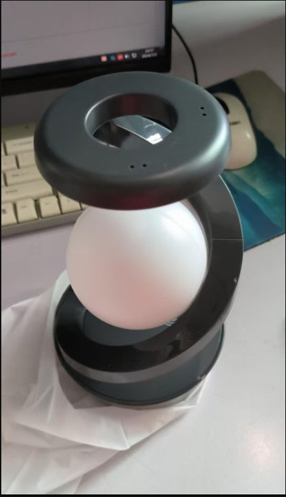 A realistic 3D printed moon lamp with rotating feature and soft glow